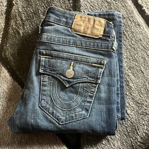 Light washed True Religion jeans size 25 that have been slightly worn.